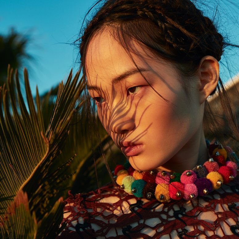 Image may contain: Human, Person, Plant, Flower, and Blossom